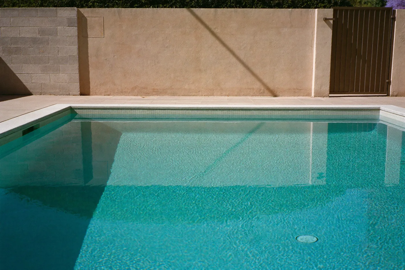 The same pool restored to clear turquoise water with a visible floor.